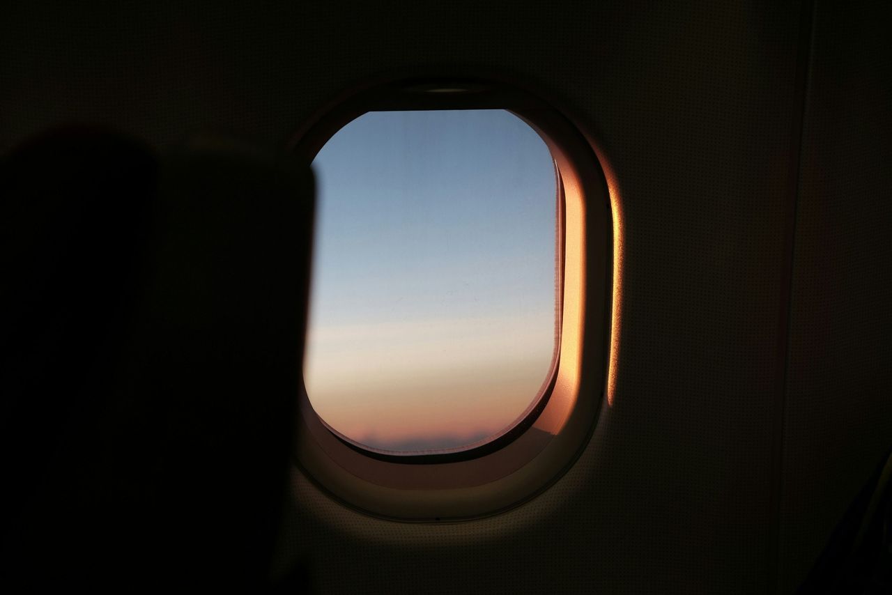 The view from an aeroplane window at sunset
