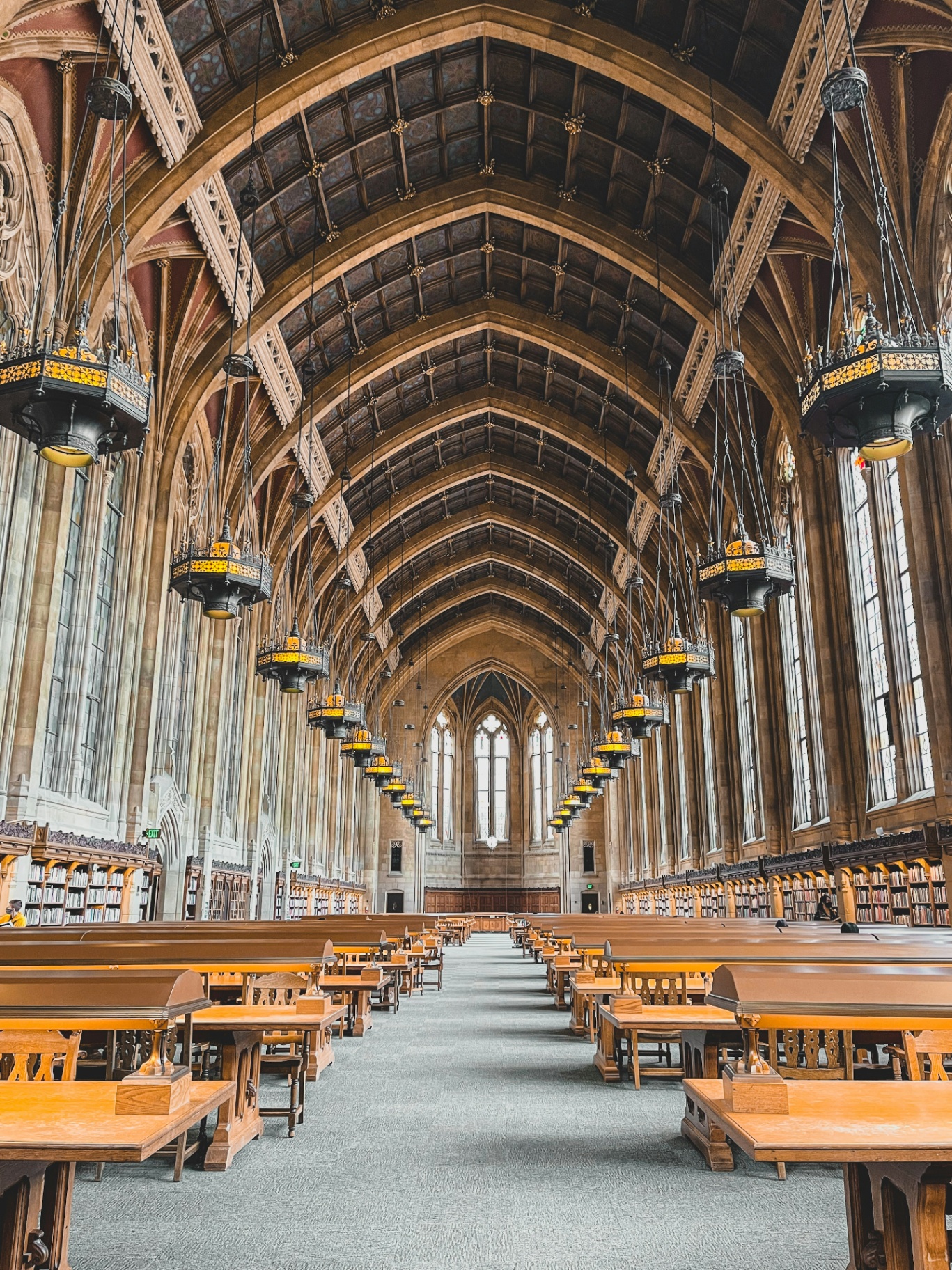 Vaulted Gothic university library reading hall.