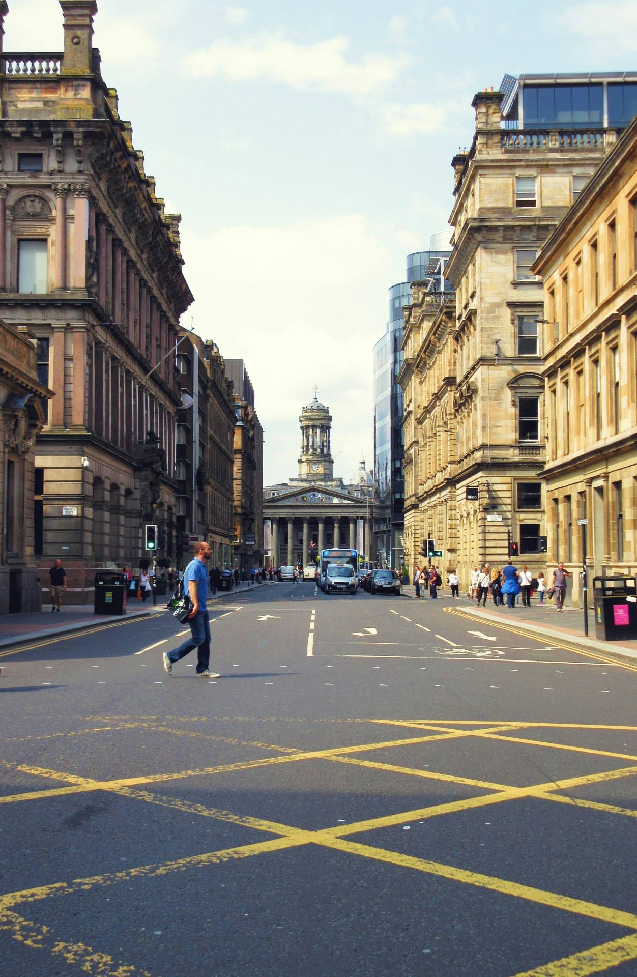 A city street lined with historic buildings in the United Kingdom.